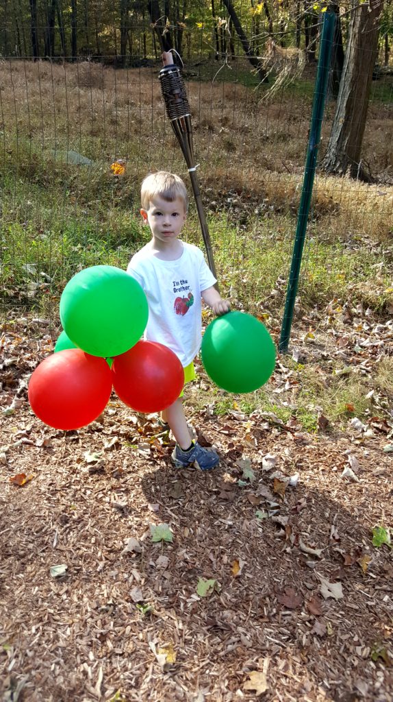 My son playing with the balloons