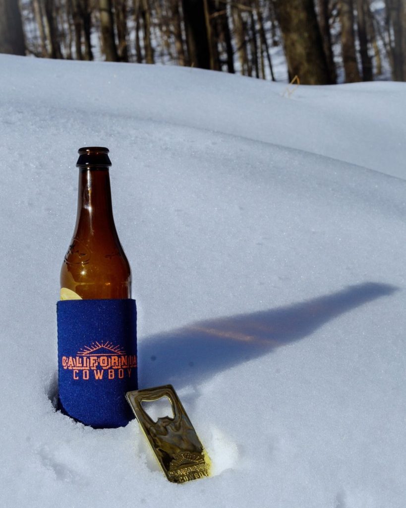 Beer koozie and bottle opener from California Cowboy