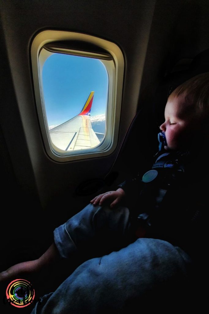 Baby sleeping on an airplane