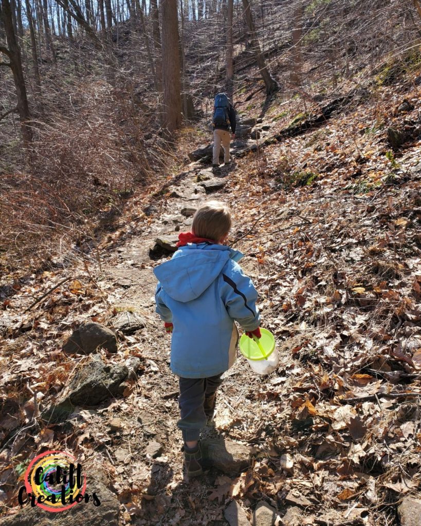 Hiking Popolopen Gorge Trail with his hiking treasure bucket