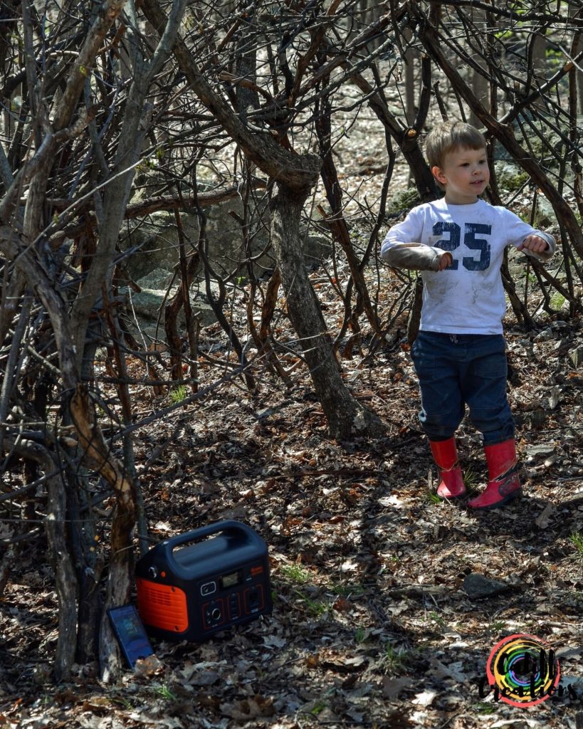 My son dancing in our fort, the Jackery portable power station is how we power the outdoors