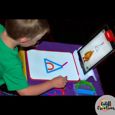 My son playing with the sticks and rings for his Osmo Play System