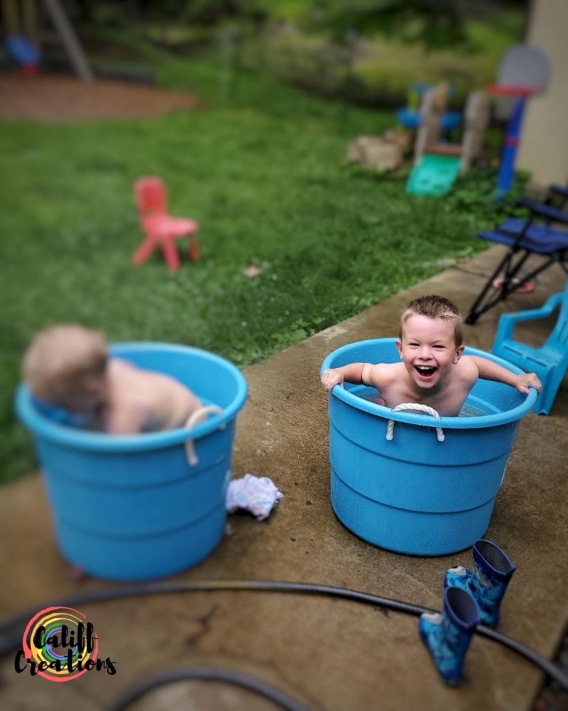 Taking a summer bath in a bucket