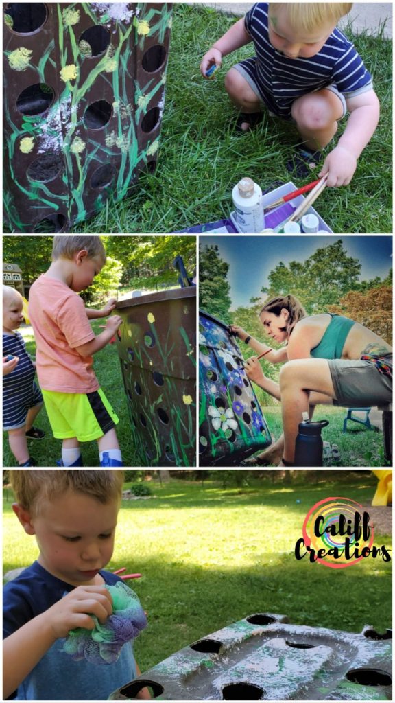 painting the DIY garbage can compost bin with my kids