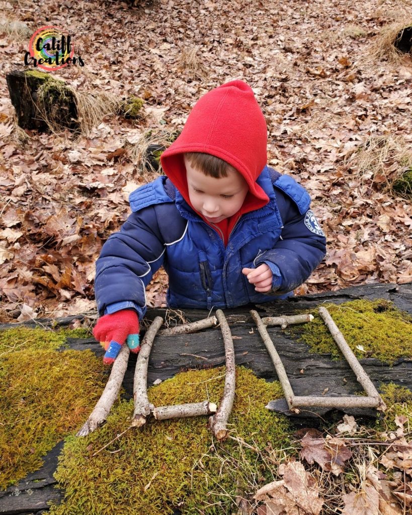 Making numbers and letters out of sticks, learning outside