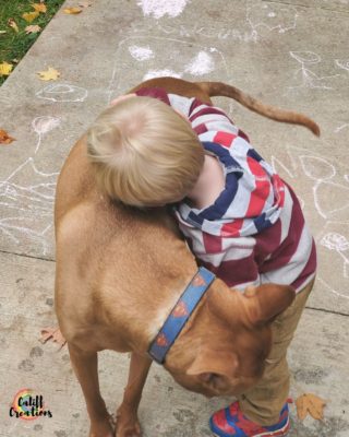 My youngest hugging our dog