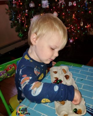 My toddler concentrating on simple Christmas activities